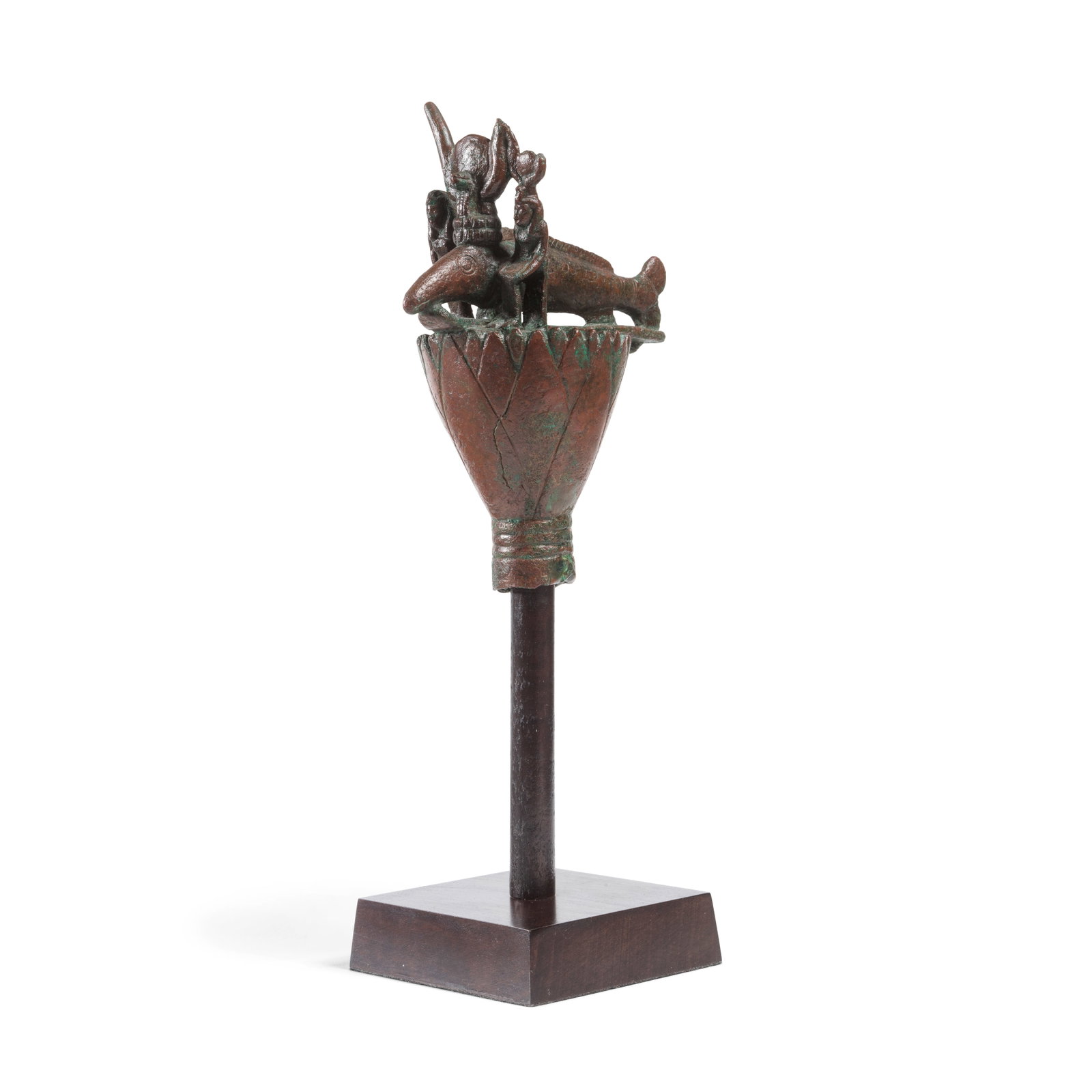 An Egyptian bronze finial with oxyrhynchus fish: An Egyptian bronze finial with oxyrhynchus fish Late Period, circa 664-380 B.C. 12.5cm high Footnotes: Provenance: with Nicholas Koutoulakis (1910-1996), Geneva, circa 1960s; and thence by descent to 