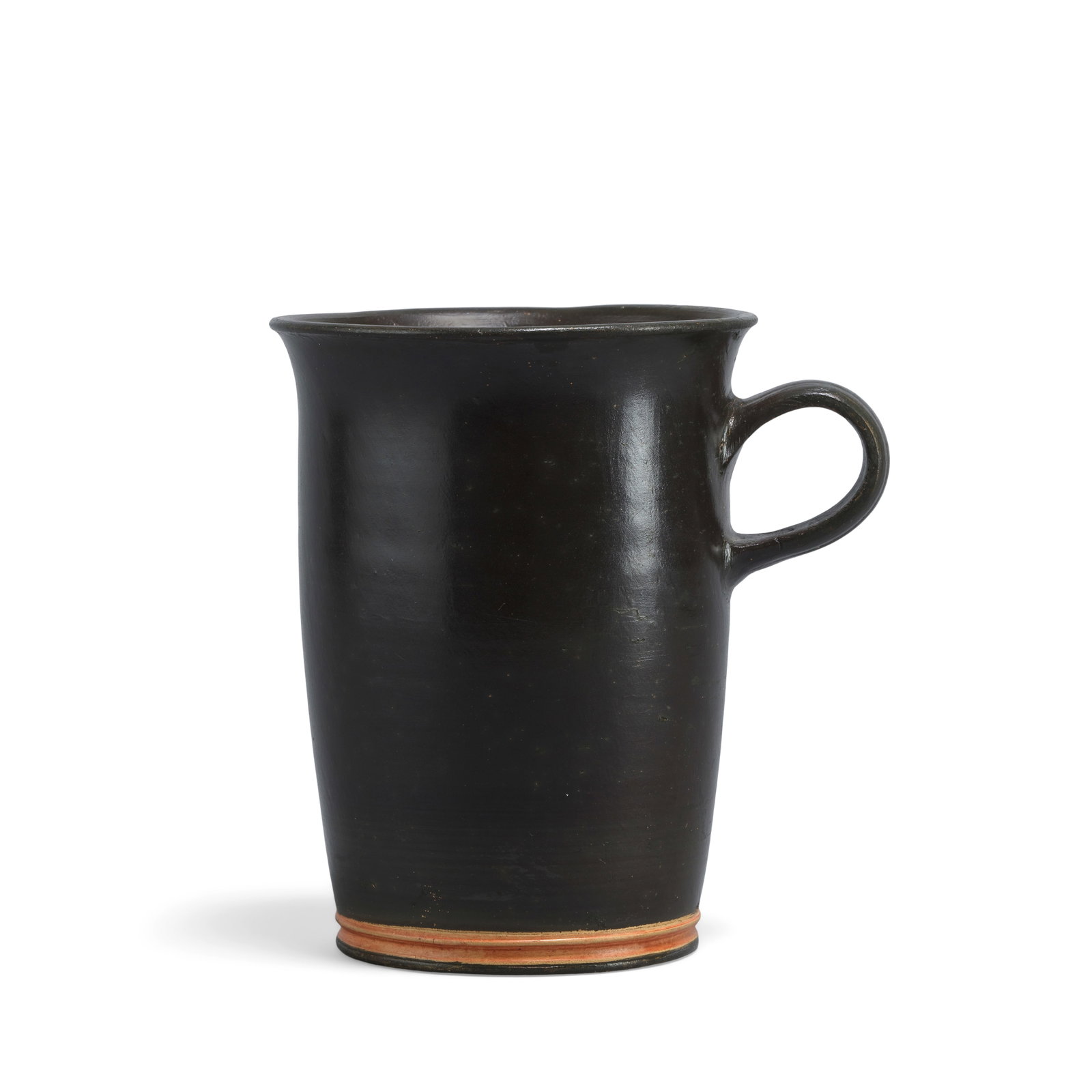 A Greek black-glazed pottery mug: A Greek black-glazed pottery mug Circa 4th Century B.C. 12cm high Footnotes: Provenance: Private collection, Germany, acquired in the 1980s. US art market. Anonymous sale; Christie's, London, 25 Octob