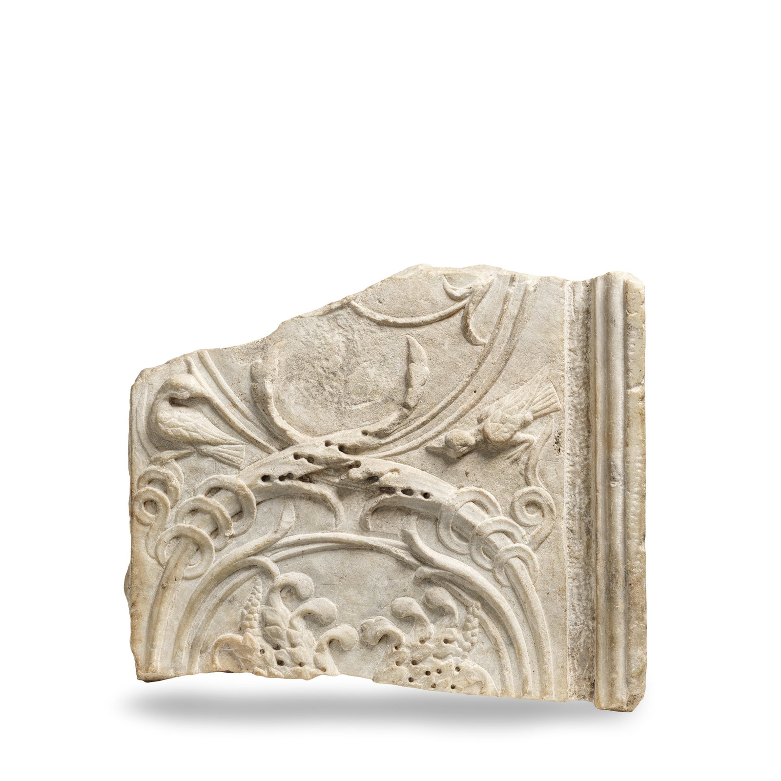 A Roman marble relief fragment with birds and foliage: A Roman marble relief fragment with birds and foliage Circa 1st-2nd Century A.D. 29.5cm x 24cm Footnotes: Provenance: Neville Hickman Collection, UK, acquired in Birmingham in 1961. Anonymous sale; Bo