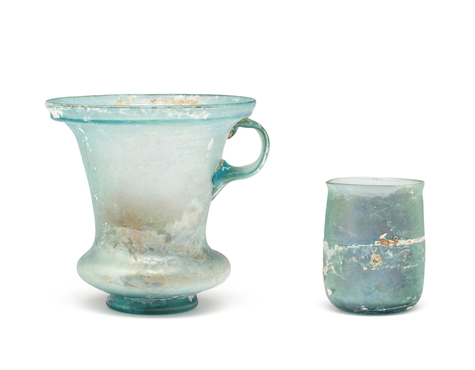 A Roman aquamarine glass modiolus and a Roman greenish-blue glass beaker 2 (1 of 1)