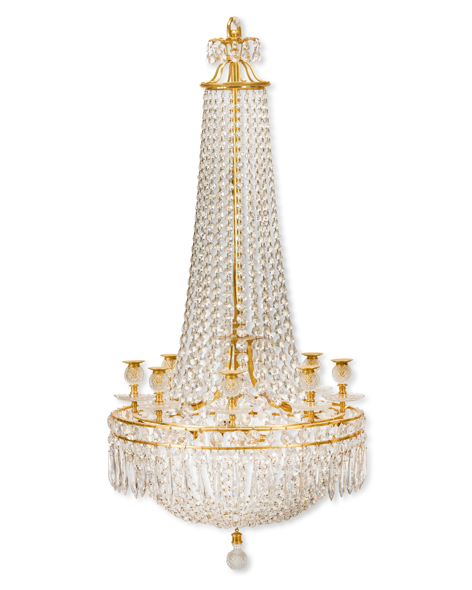 A 19th century gilt brass and cut glass eight light tent, waterfall and bag chandelier Probably...: A 19th century gilt brass and cut glass eight light tent, waterfall and bag chandelier Probably English, circa 1820-30, stamped to the frame: '1 S' The globular diamond cut nozzles above scalloped dri