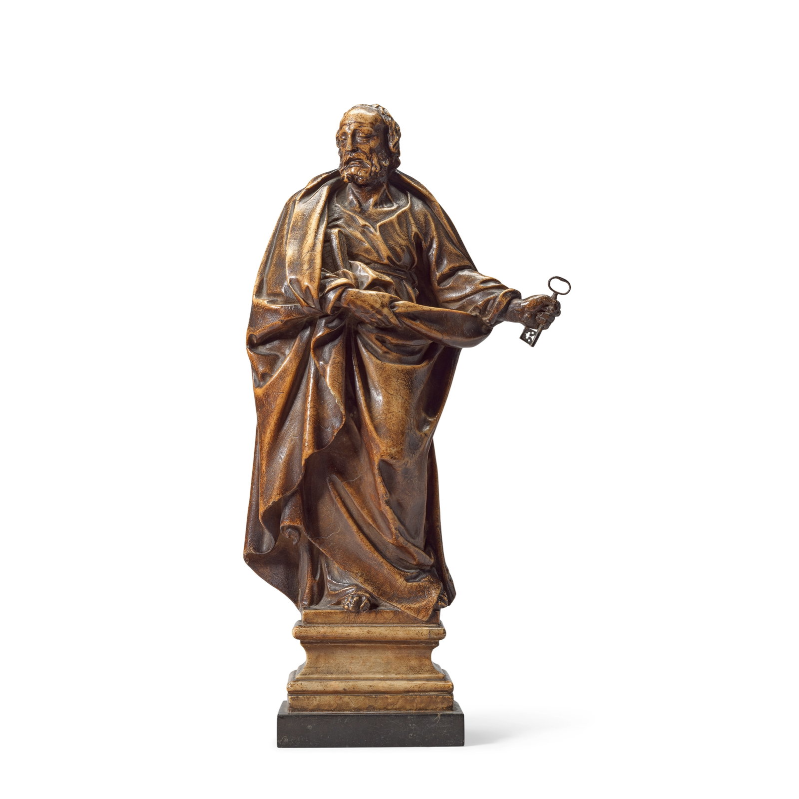 A carved and alabaster figure of Saint Peter Italo-Flemish, circa 1600: A carved and alabaster figure of Saint Peter Italo-Flemish, circa 1600 The saint looking to dexter, with curling beard and hair, clad in a draped robe tied at the waist and a flowing cloak clutched by