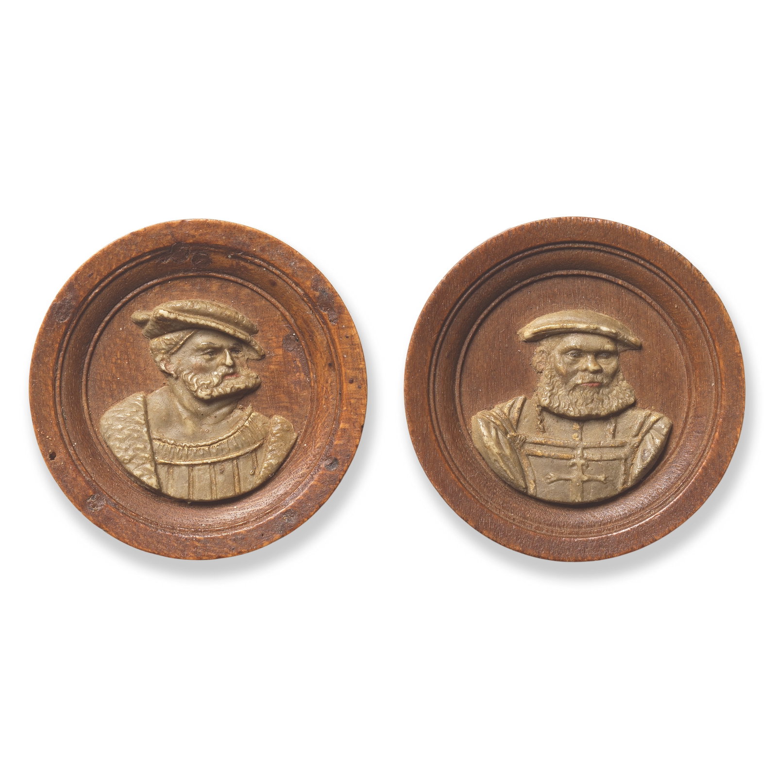 A pair of rare turned pearwood and ground honestone (gesso) gaming counters or spielmarken South...: A pair of rare turned pearwood and ground honestone (gesso) gaming counters or spielmarken South German, second quarter 16th century The fronts with moulded borders framing sculpted portrait reliefs o