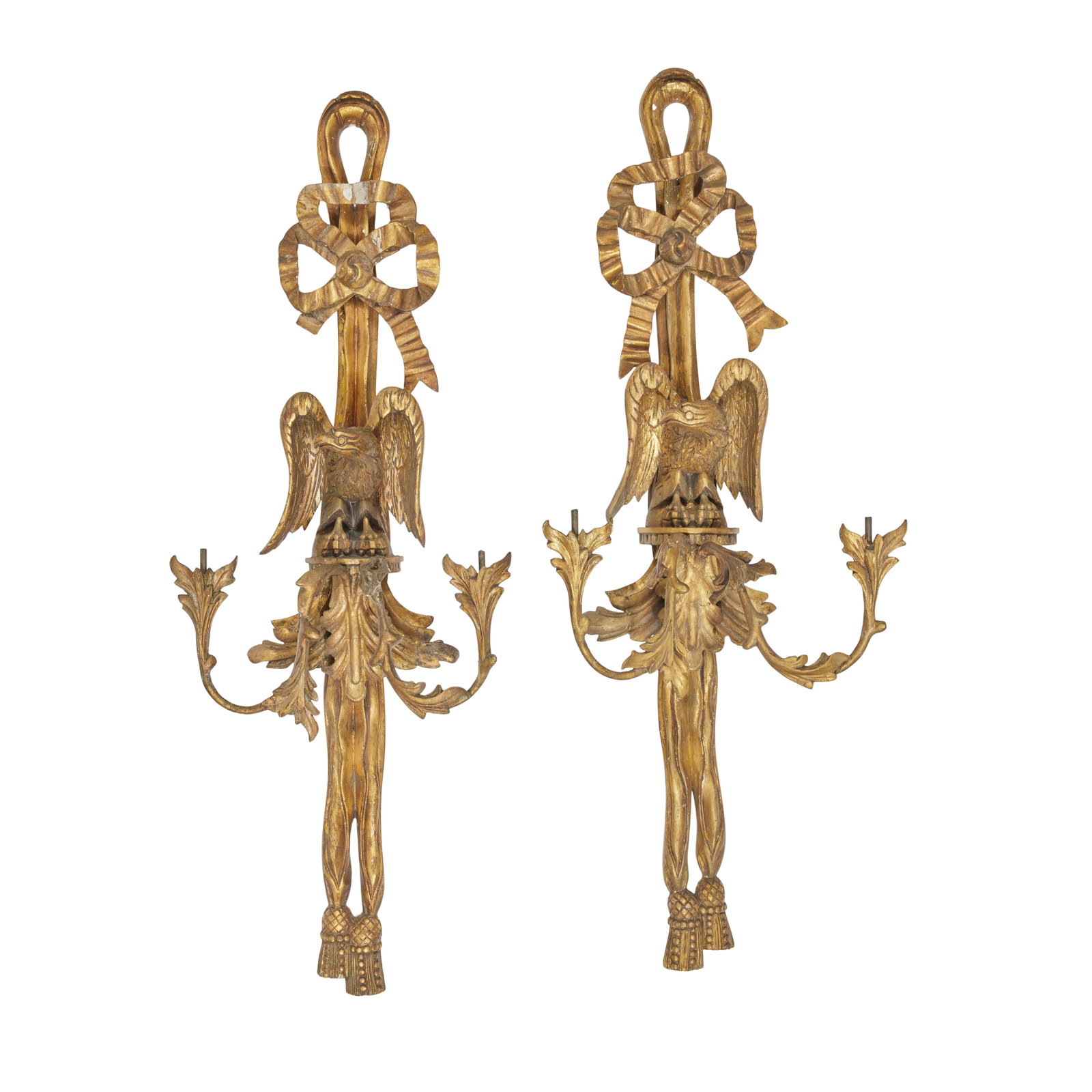 A set of six carved giltwood and gesso twin-branch wall lights Late 19th century (6): A set of six carved giltwood and gesso twin-branch wall lights Late 19th century Each with tied ribbon and double foliate branches (lacking sconces) surmounted with perched eagle, 31.5cm wide, 18cm de
