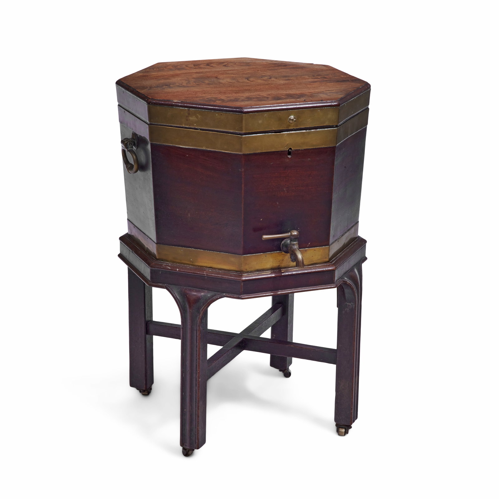 A large George III mahogany and brass bound octagonal cellarette Third quarter 18th century: A large George III mahogany and brass bound octagonal cellarette Third quarter 18th century The hinged top enclosing a fitted lead lined divided interior with a brass tap, the sides fitted with brass 
