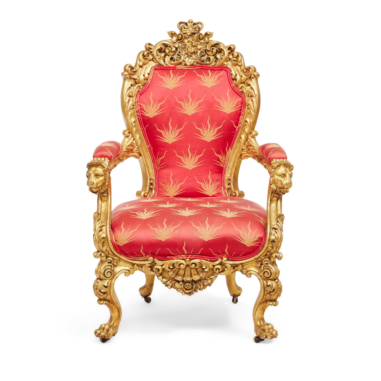 A Victorian carved giltwood armchairMid-19th century in the Baroque taste: A Victorian carved giltwood armchair Mid-19th century in the Baroque taste The upholstered back surmounted by a carved Crown crest above the United Floral Badge, consisting of a rose, thistle and sham