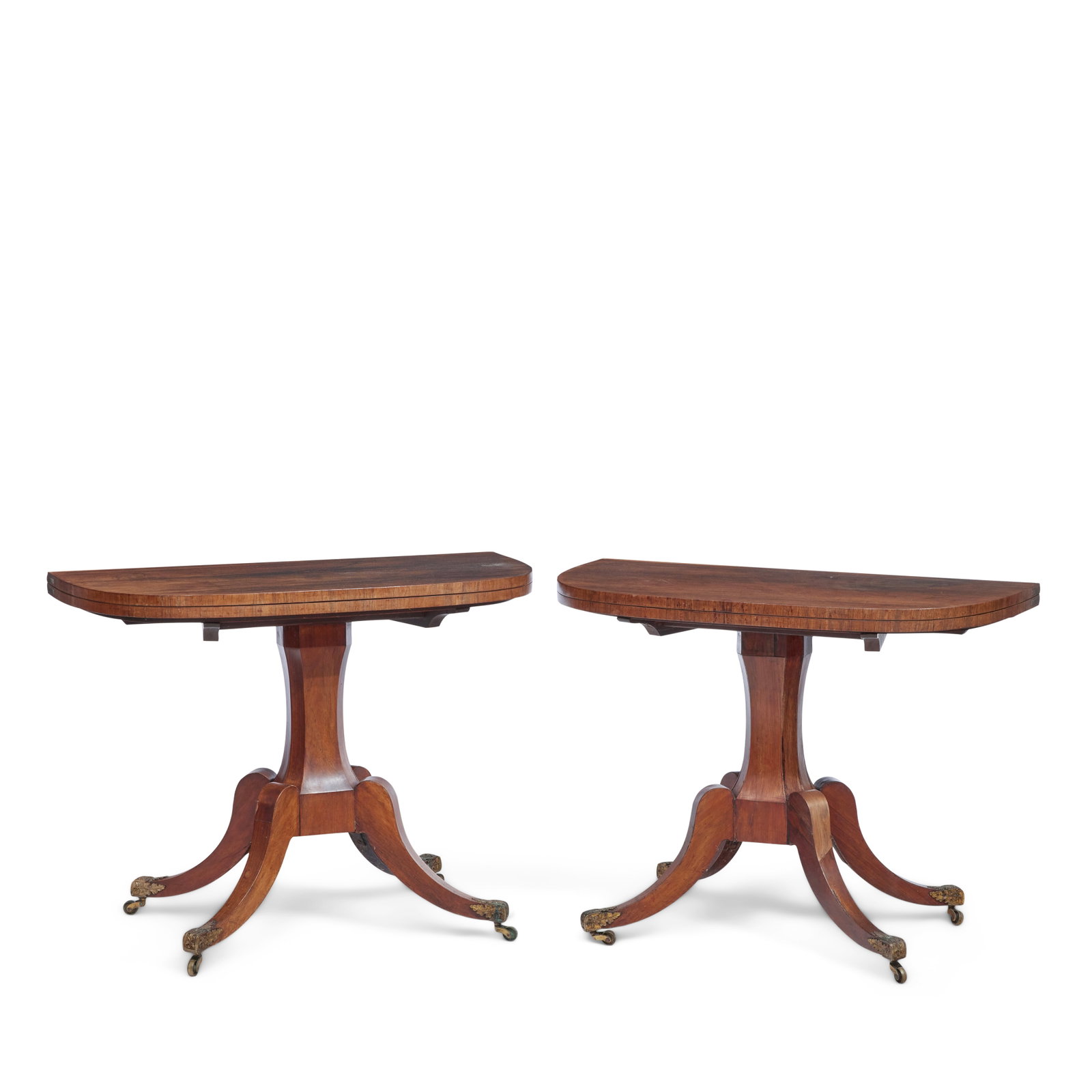 A pair of Scottish Regency rosewood card tables Early 19th century, attributable to William Trot...: A pair of Scottish Regency rosewood card tables Early 19th century, attributable to William Trotter (1772-1833) The rotating D-shaped hinged tops above waisted octagonal columns on down-swept legs wit