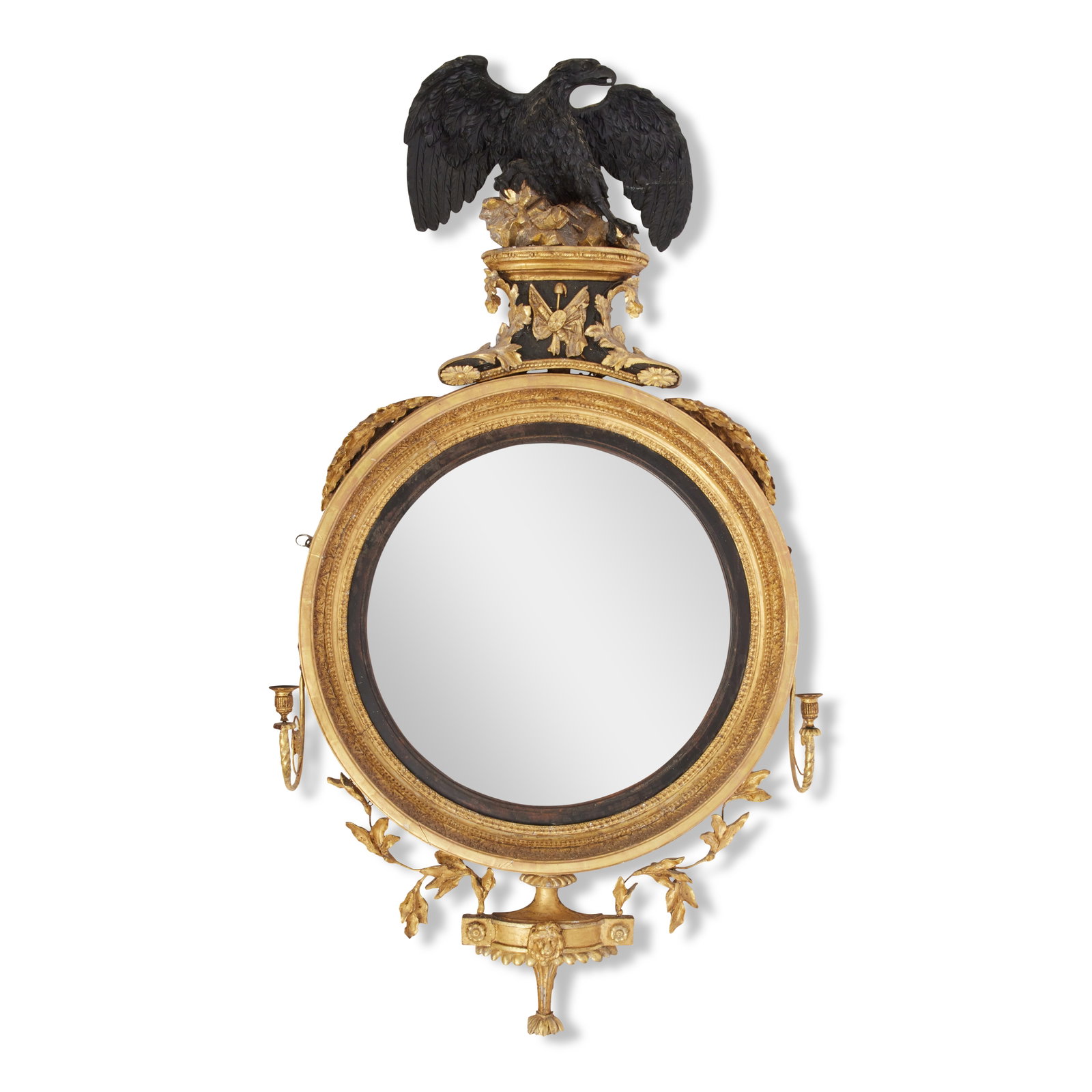 A large Regency carved giltwood and gesso convex girandole mirror Early 19th century and later: A large Regency carved giltwood and gesso convex girandole mirror Early 19th century and later The circular plate within an ebonised reeded slip flanked by a pair of scrolled candle arms with brass sc