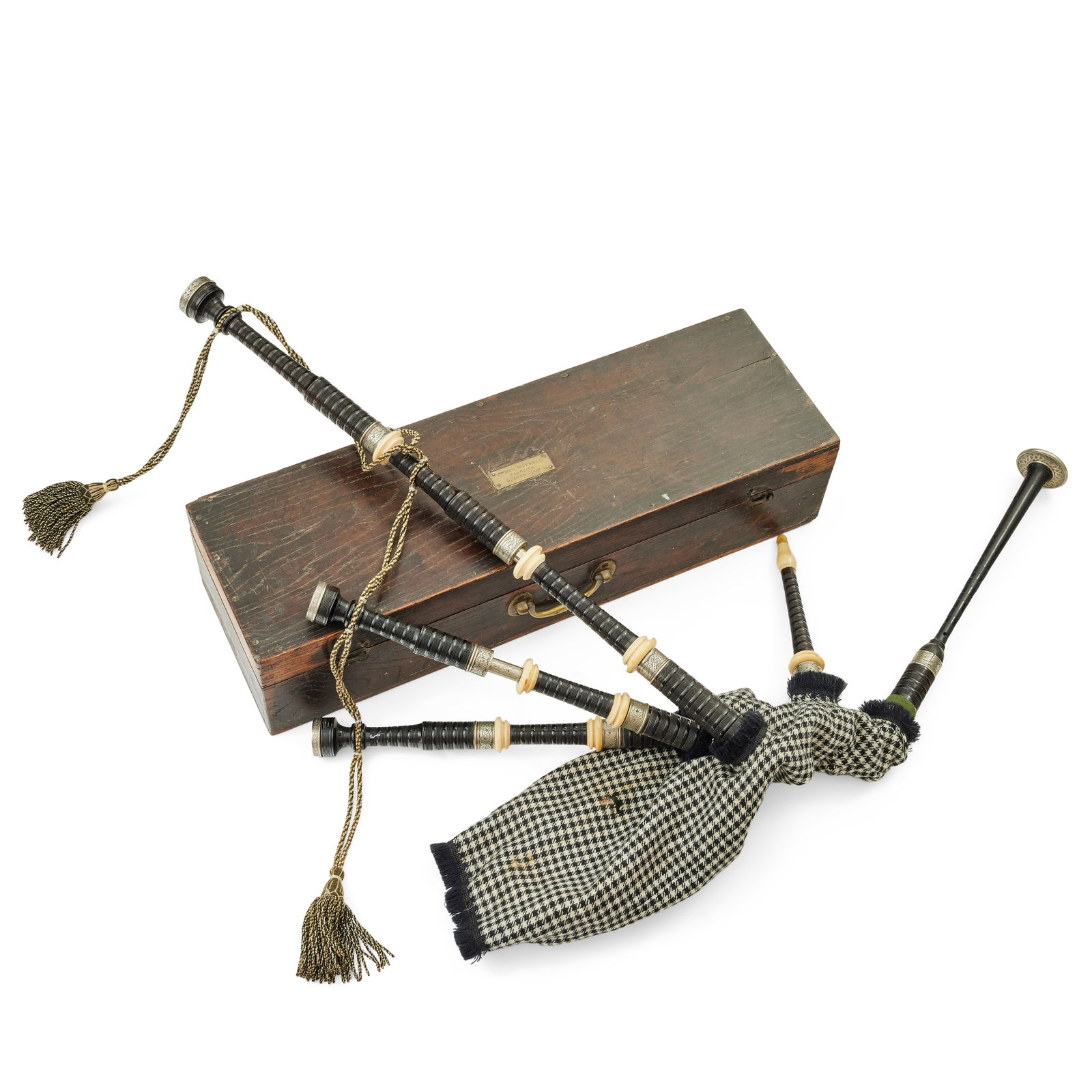 A late 19th century set of nickel and ivory mounted bagpipes Attributed to Starck: A late 19th century set of nickel and ivory mounted bagpipes Attributed to Starck Of turned blackwood with hounds tooth fabric covered gortex bag, the mounts engraved with interlaced designs, the chan