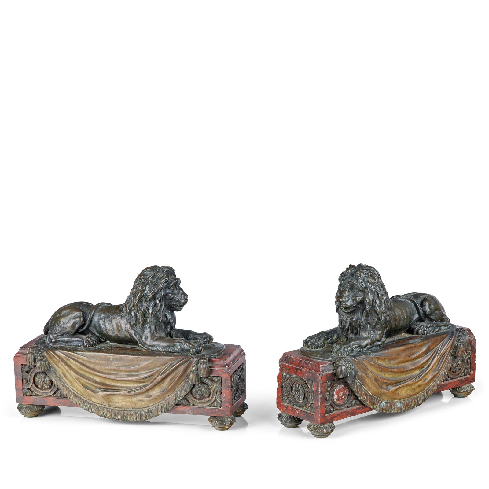 A pair of French 19th century bronze lions (2): A pair of French 19th century bronze lions Both recumbent with paws outstretched, raised on a rouge marble rectangular plinths, with squat acanthus bun feet, 34.5cm wide, 12cm deep, 24cm high (13 1/2i