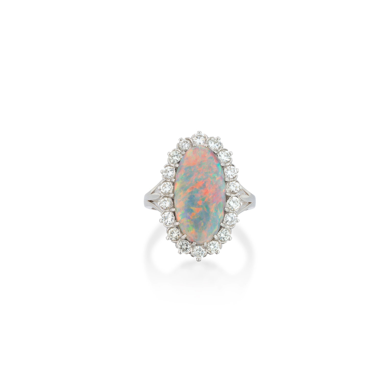 OPAL AND DIAMOND RING, 1984: OPAL AND DIAMOND RING, 1984 The oval-shaped cabochon opal set to a border of brilliant-cut diamonds, mounted in platinum, London hallmark, ring size approx. M½ Footnotes: A Private Family Legacy 