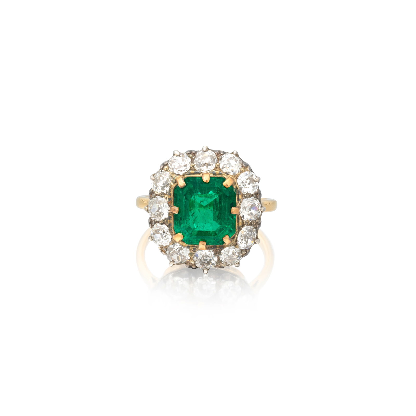 EMERALD AND DIAMOND CLUSTER RING: EMERALD AND DIAMOND CLUSTER RING The octagonal step-cut emerald within an old brilliant-cut diamond surround, emerald approx. 3.50cts, diamonds approx. 1.80cts total, ring size approx. O½ Footnot