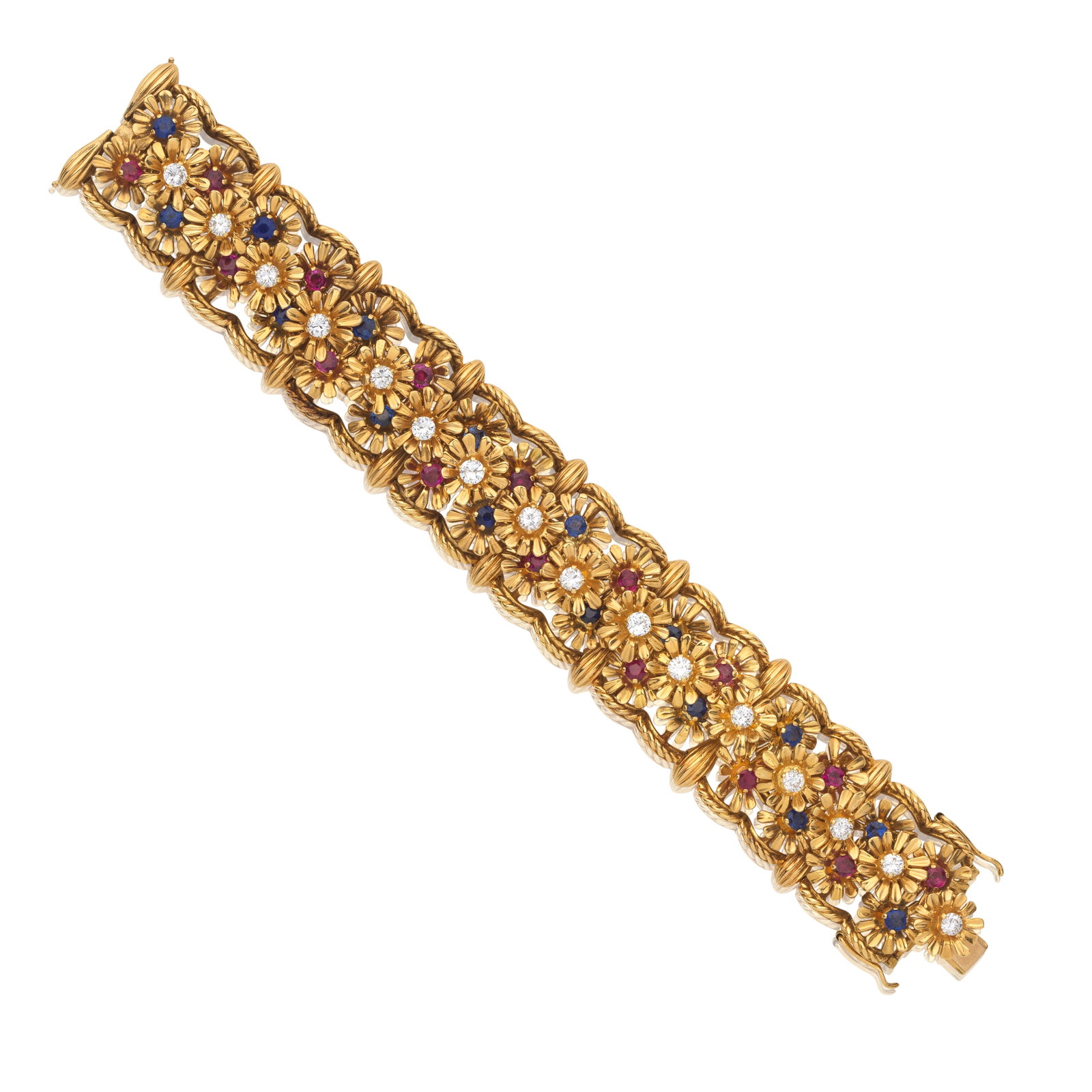 SANNIT & STEIN: DIAMOND, RUBY AND SAPPHIRE-SET BRACELET, 1957: SANNIT & STEIN: DIAMOND, RUBY AND SAPPHIRE-SET BRACELET, 1957 Each link comprising clusters of rotating flowerheads, each set with a brilliant-cut diamond, circular-cut ruby or sapphire, mounted in 18