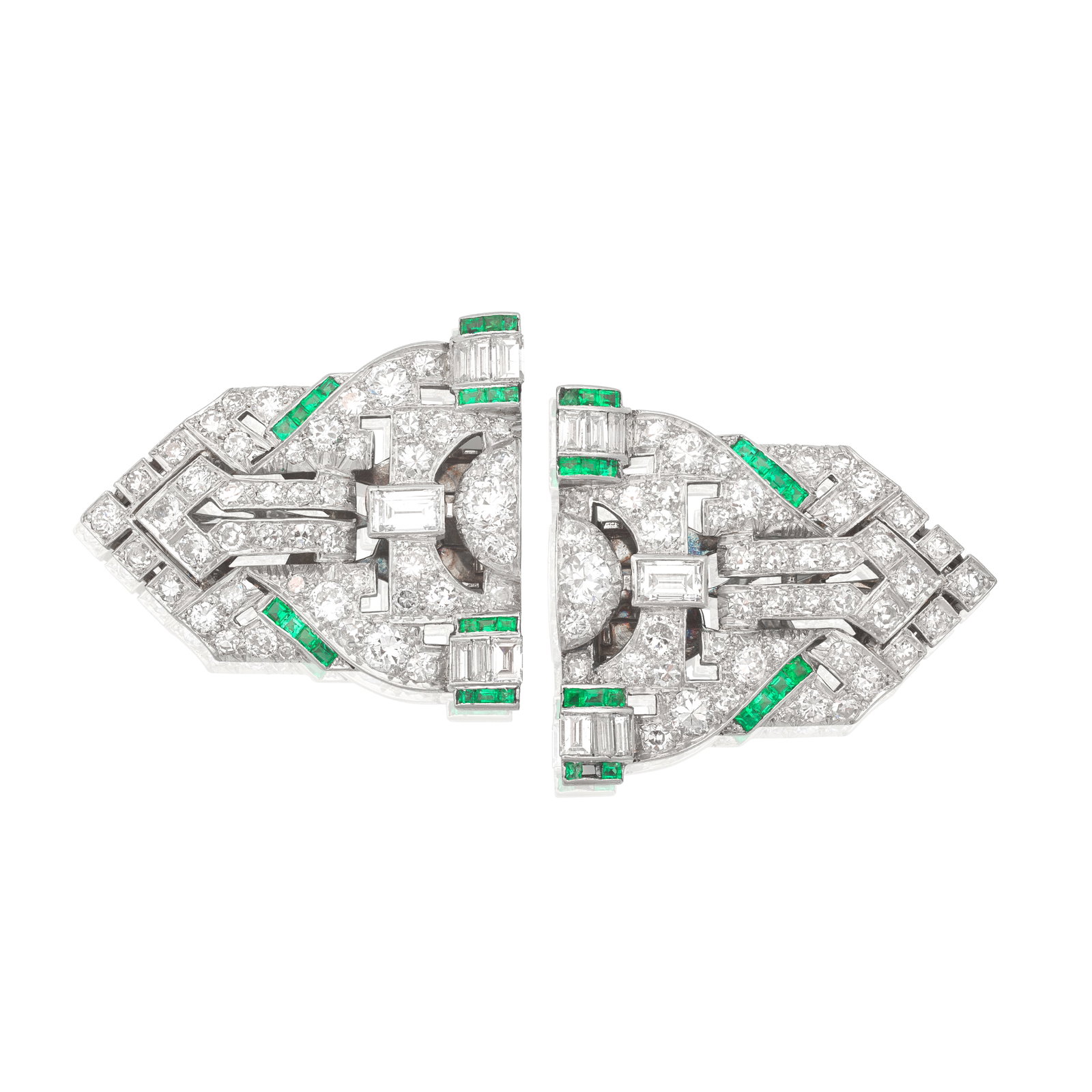 TWO EMERALD AND DIAMOND CLIPS, CIRCA 1935: TWO EMERALD AND DIAMOND CLIPS, CIRCA 1935 Of geometric design with openwork detailing, set with old brilliant, baguette and single-cut diamonds, accented by square-cut emeralds, diamonds approx. 6.00c