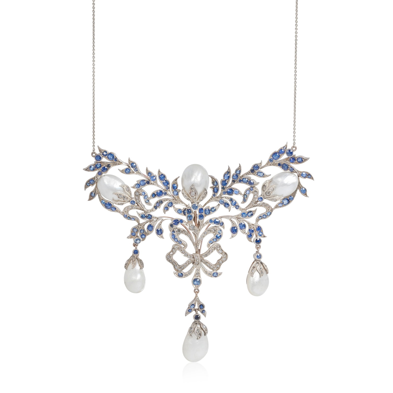 SAPPHIRE AND PEARL NECKLACE: SAPPHIRE AND PEARL NECKLACE Designed as a corsage of circular-cut sapphire leaves, and pearl buds, tied together with a rose-cut diamond ribbon, sapphire deficient, length of corsage 11.5 x 10.2cm, ne