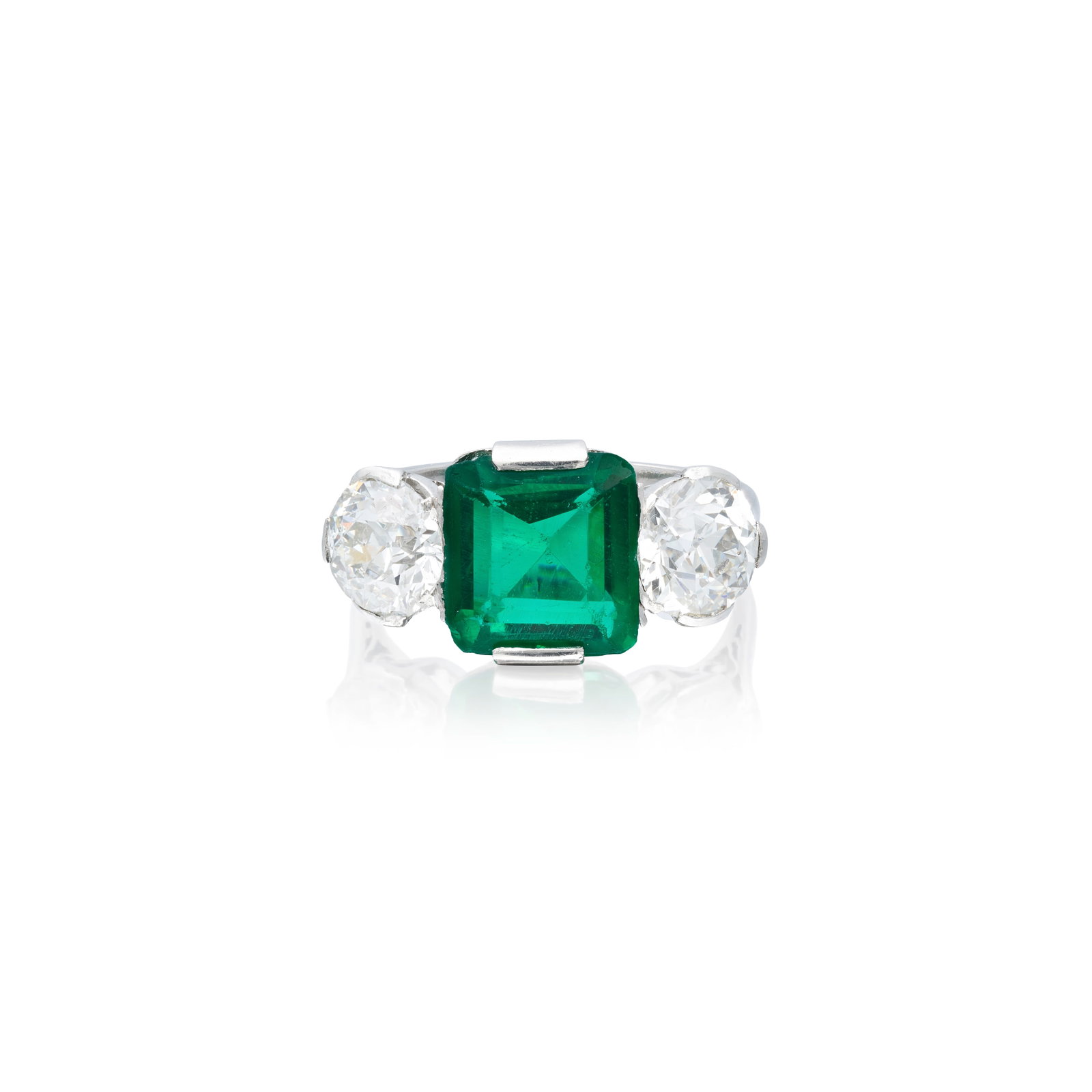GREEN PASTE AND DIAMOND THREE STONE RING: GREEN PASTE AND DIAMOND THREE STONE RING The step-cut paste between two old brilliant-cut diamonds weighing 1.01 carats and 1.04 carats, ring size approx. K Footnotes: A Private Family Legacy Lots 1 -