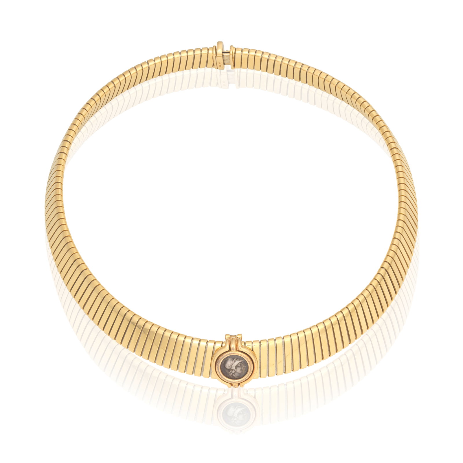 BULGARI: 'MONETE' TUBOGAS NECKLACE, CIRCA 1994: BULGARI: 'MONETE' TUBOGAS NECKLACE, CIRCA 1994 The ancient coin rubover-set, to a collar necklace of sprung design, coin detachable from necklace, inscribed to reverse CARIA-KAUNOS 2nd cent B.C., coin