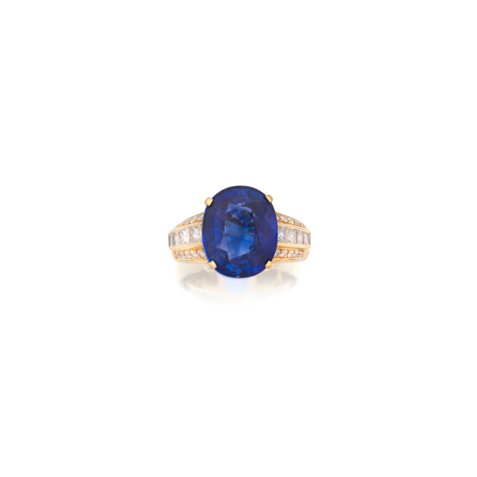 BOODLES: SAPPHIRE AND DIAMOND RING, 2000: BOODLES: SAPPHIRE AND DIAMOND RING, 2000 The oval-cut sapphire weighing 9.19 carats, between rows of princess and brilliant-cut diamonds, mounted in 18 carat gold, signed Boodles, maker's mark B&D, Lo