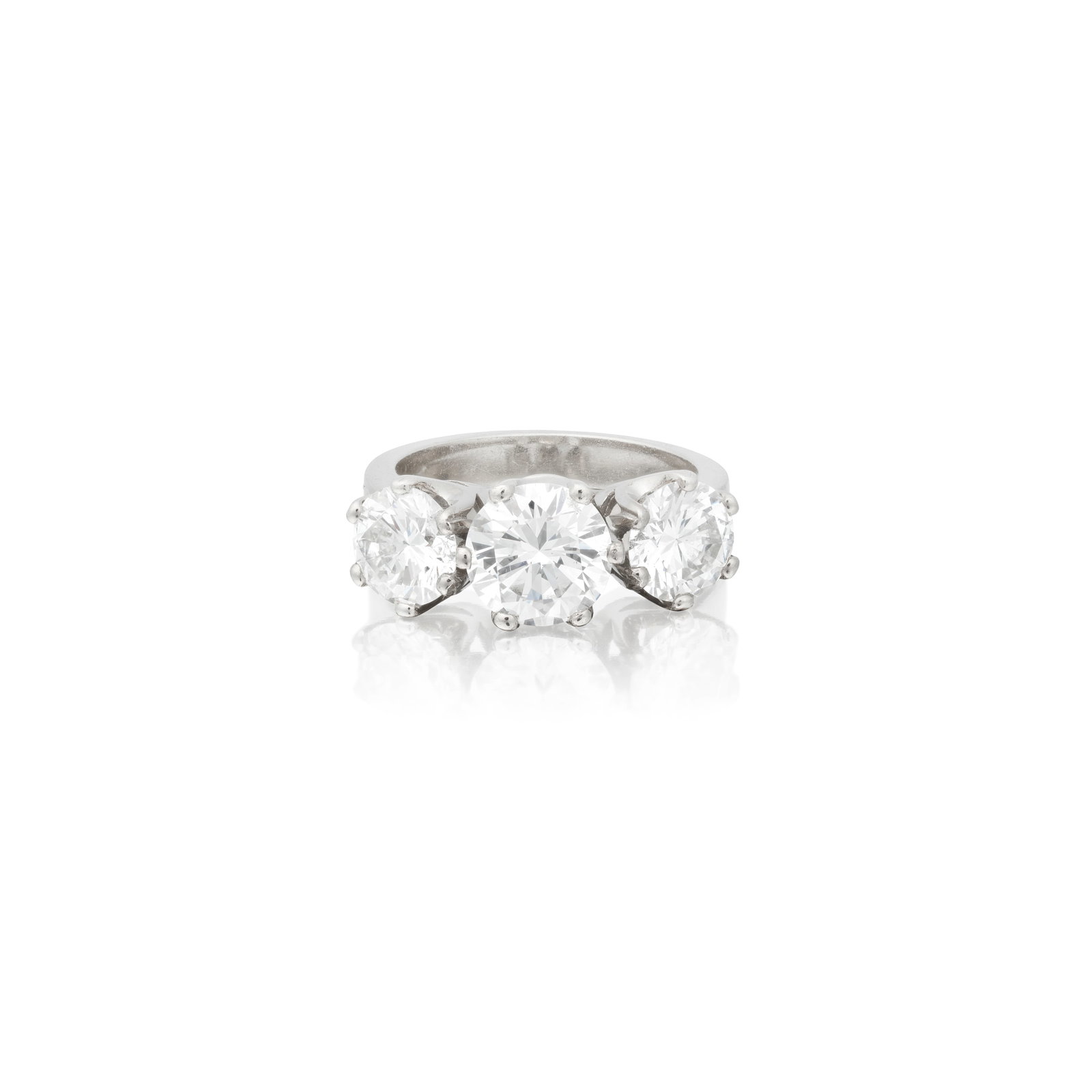 DIAMOND THREE-STONE RING: DIAMOND THREE-STONE RING The principal brilliant-cut diamond weighing 1.41 carats, between two similarly-cut diamonds, remaining diamonds approx. 1.80cts total, ring size approx. K For further informa