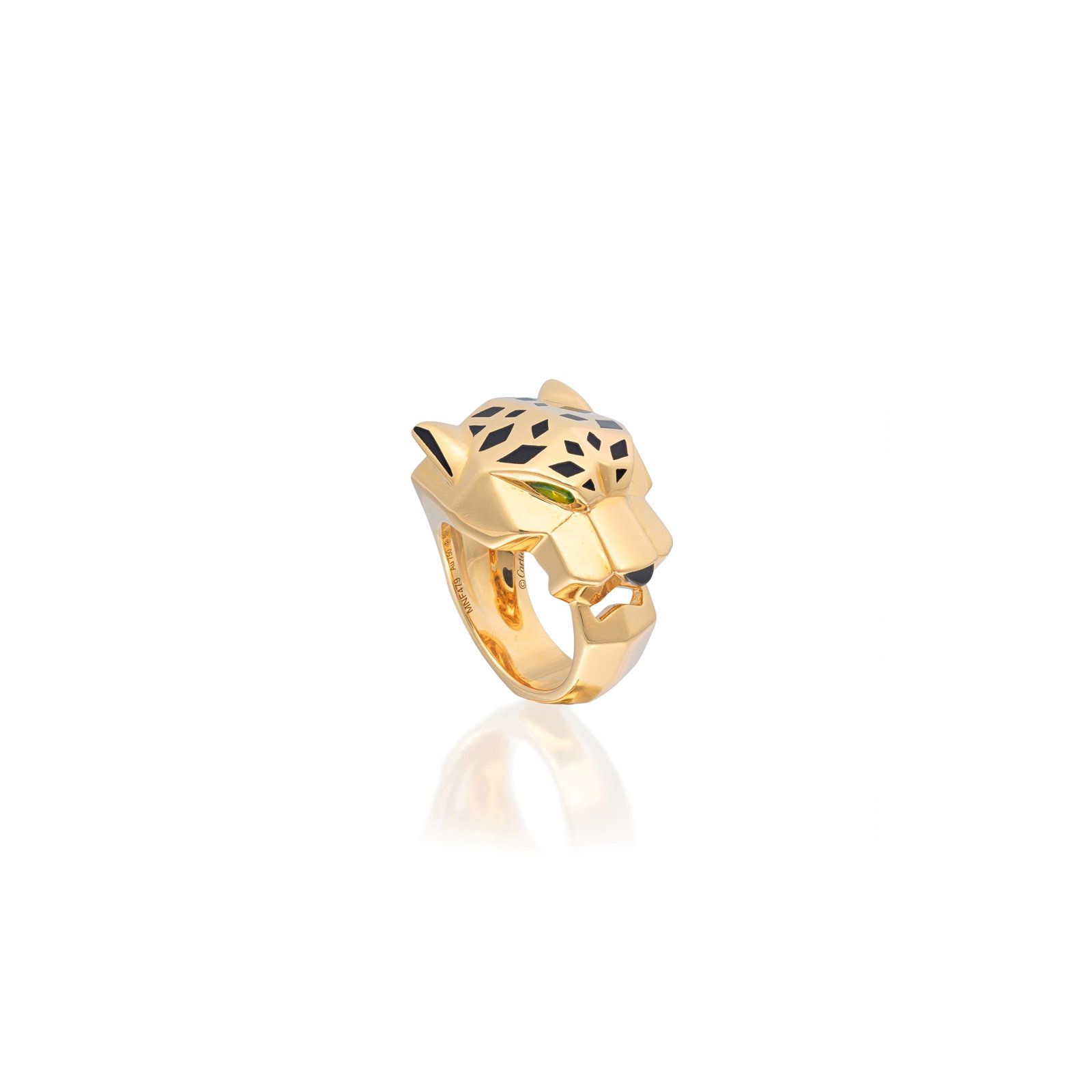 CARTIER: 'PANTHÈRE' RING: CARTIER: 'PANTHÈRE' RING The stylised panther head, accented by black lacquer spots, pear-shaped peridot eyes and an onyx nose, signed Cartier, numbered MNF479, French workshop mark, French assay
