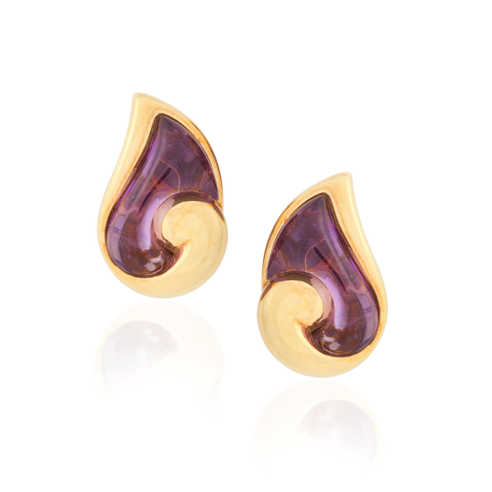 BULGARI: AMETHYST EARCLIPS, CIRCA 1991: BULGARI: AMETHYST EARCLIPS, CIRCA 1991 Of boteh design, with fancy-cut cabochon amethysts, mounted in 18 carat gold, signed Bulgari, maker's mark S.B, London import mark, length 2.8cm For further info