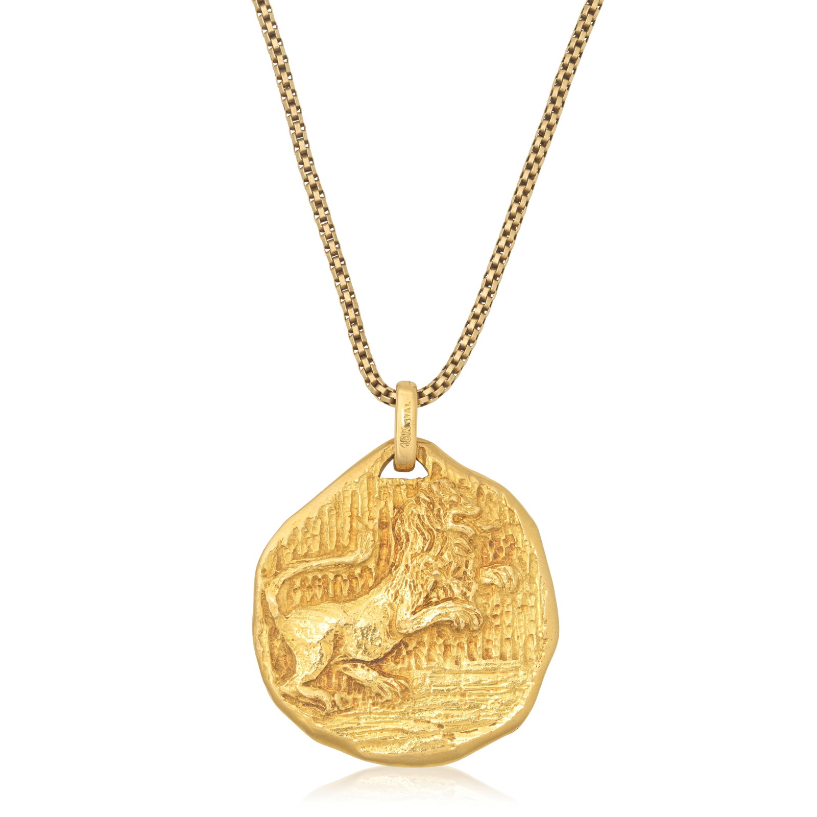 TIFFANY: ZODIAC PENDANT: TIFFANY: ZODIAC PENDANT The abstract pendant depicting a rearing lion, raised in relief, representing the zodiac symbol for Leo, suspended from a box link chain, bale signed Tiffany & Co., chain unsig