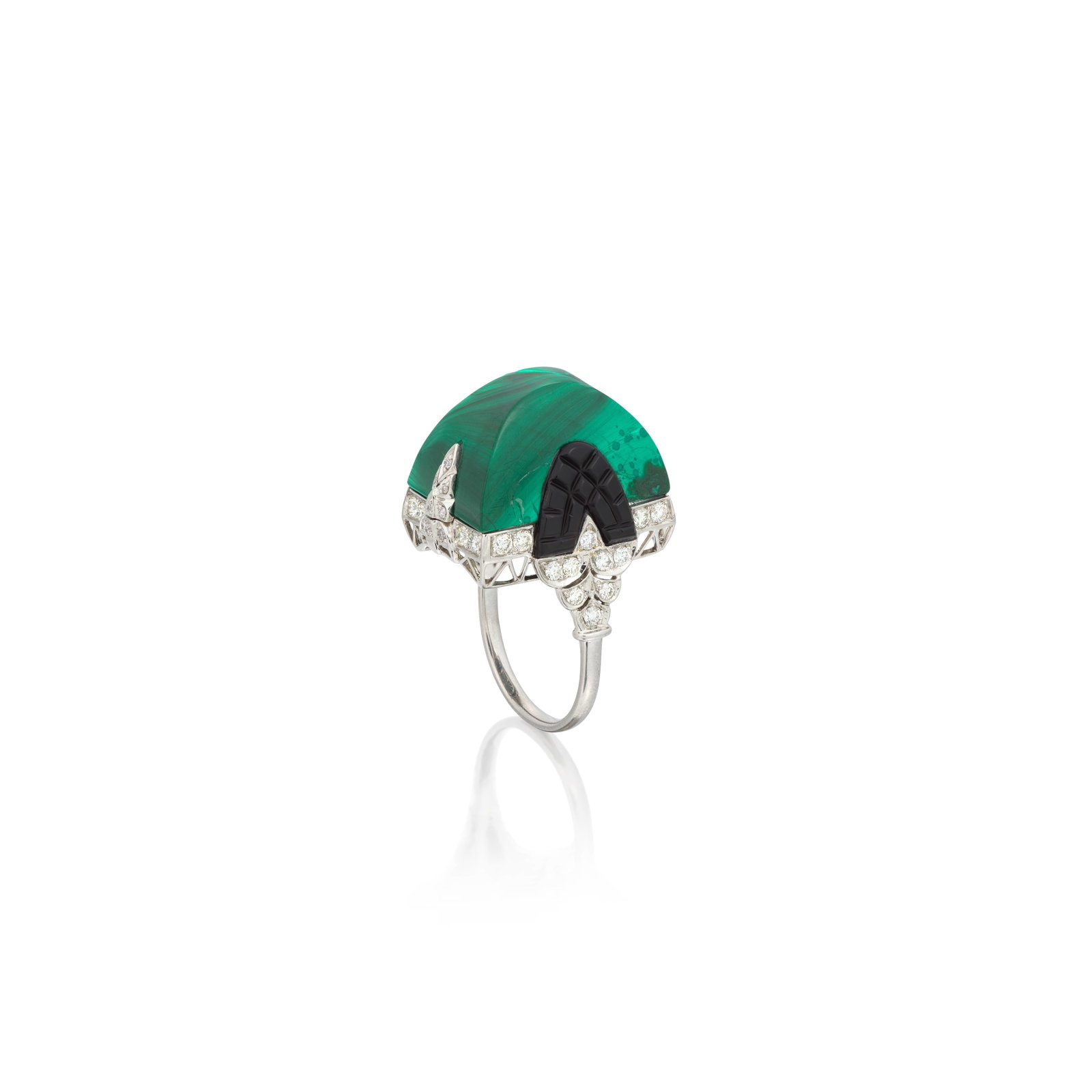 MALACHITE, DIAMOND AND ONYX DRESS RING: MALACHITE, DIAMOND AND ONYX DRESS RING The dome-shaped malachite between shoulders of carved onyx and brilliant-cut diamonds within a scalloped edge setting, further accented to the gallery by similar
