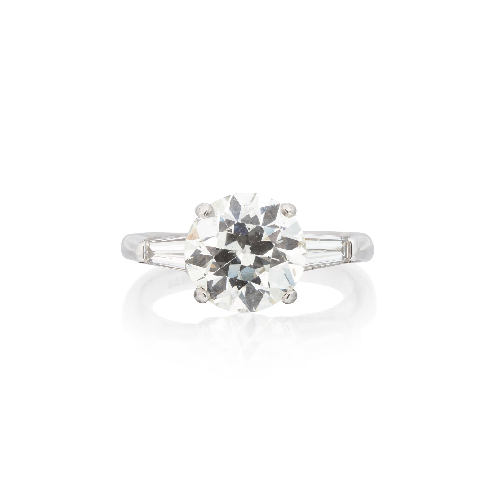 DIAMOND SINGLE-STONE RING: DIAMOND SINGLE-STONE RING The old brilliant-cut diamond weighing 3.13 carats, between tapered baguette-cut diamond shoulders, partial London hallmark, ring size approx. O½ For further information