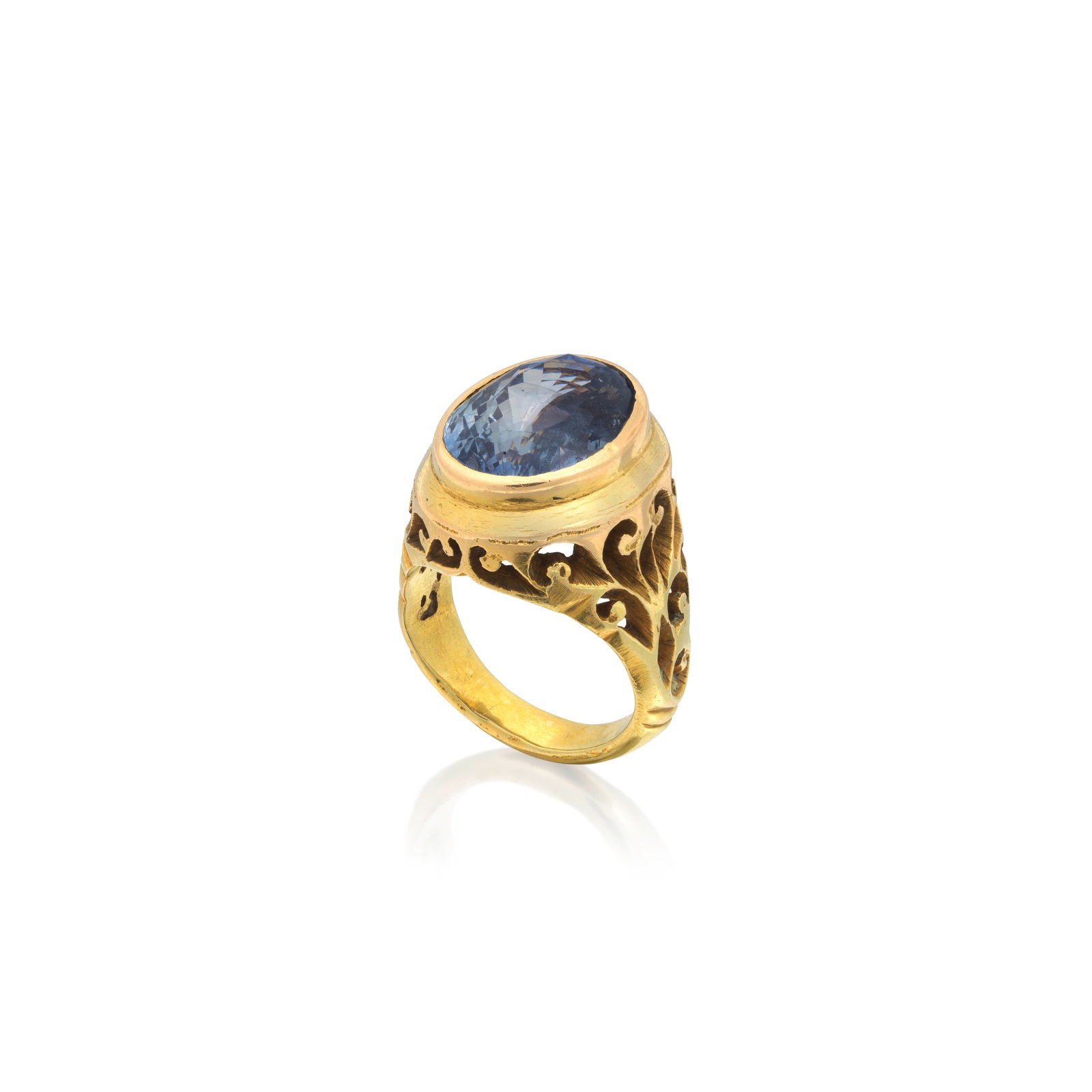 SAPPHIRE RING: SAPPHIRE RING The oval-cut sapphire in a rub-over setting, to pierced scroll work gallery and shoulders, sapphire approx. 13.40cts, ring size approx. N½ Footnotes: GCS: Sapphire of Sri Lankan ori