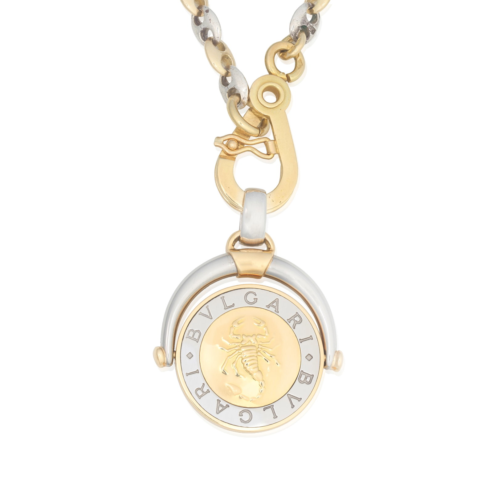 BULGARI: ZODIAC PENDANT: BULGARI: ZODIAC PENDANT The bicoloured swivel fob pendant depicting the Scorpio Zodiac, suspended from an unassociated silver and gold mariner link chain, signed Bulgari, chain with French workshop ma