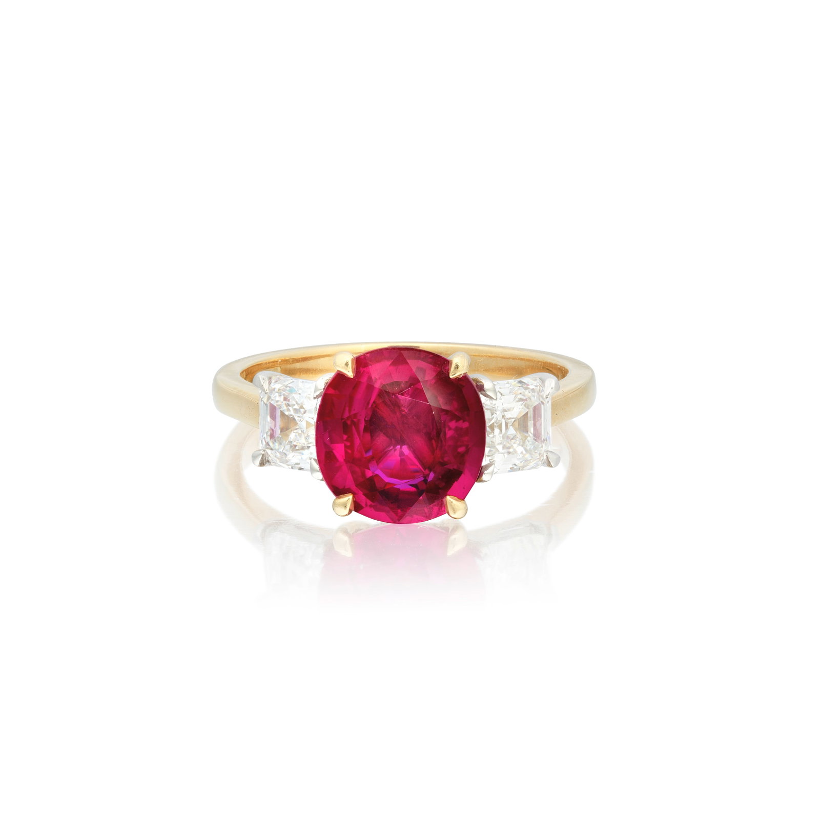 RUBY AND DIAMOND THREE STONE RING, 2018: RUBY AND DIAMOND THREE STONE RING, 2018 The cushion-cut ruby weighing 3.34 carats, between Asscher-cut diamond shoulders weighing 0.71 carat and 0.73 carat, mounted in 18 carat gold, London hallmark, 