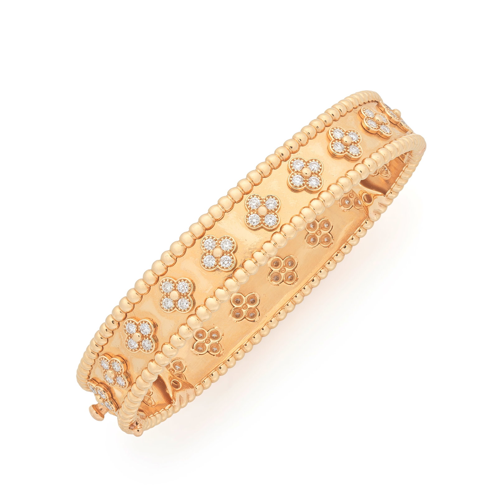 VAN CLEEF & ARPELS: DIAMOND 'PERLÉE CLOVERS' BANGLE: VAN CLEEF & ARPELS: DIAMOND 'PERLÉE CLOVERS' BANGLE The row of quatrefoil motifs set with brilliant-cut diamonds, within a beaded border, signed VCA, numbered CL25895, inner circumference approx.