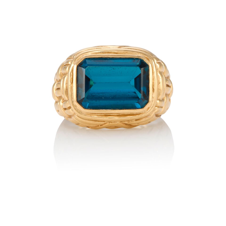 14K YELLOW GOLD AND TOPAZ RING: 14K YELLOW GOLD AND TOPAZ RING • One rectangular shaped topaz weighing approximately 7.10 carats • Size 9 • Estimated gross weight: 14.9 grams Footnotes: OVERALL CONDITION: