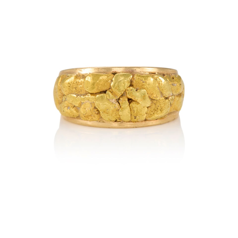 A GOLD NUGGET RING: A GOLD NUGGET RING • A 14K yellow gold ring with 20K yellow gold nuggets • Size 8 1/2 • Estimated gross weight: 17.2 grams Footnotes: OVERALL CONDITION: good Metal purity stamped