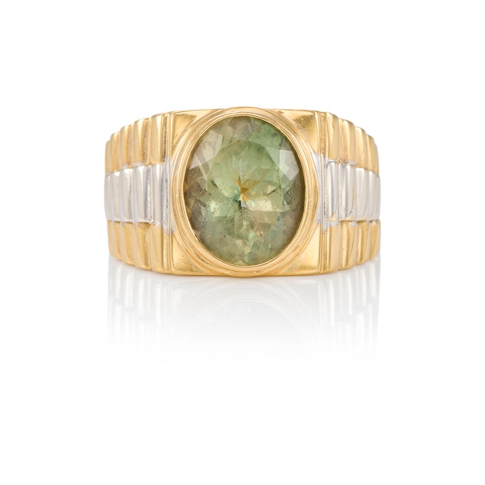 14K BICOLORED GOLD AND GREEN BERYL RING: 14K BICOLORED GOLD AND GREEN BERYL RING • One oval light green beryl weighing approximately 5.15 carats • Size 9 1/4 • Estimated gross weight: 16.7 grams Footnotes: OVERALL