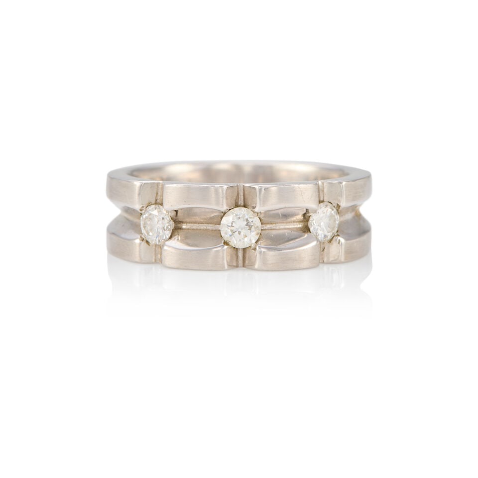 14K WHITE GOLD AND DIAMOND BAND RING: 14K WHITE GOLD AND DIAMOND BAND RING • Three round diamonds weighing approximately 0.45 carat total • Size 9 1/4 • Estimated gross weight: 10.2 grams Footnotes: OVERALL CONDITION: