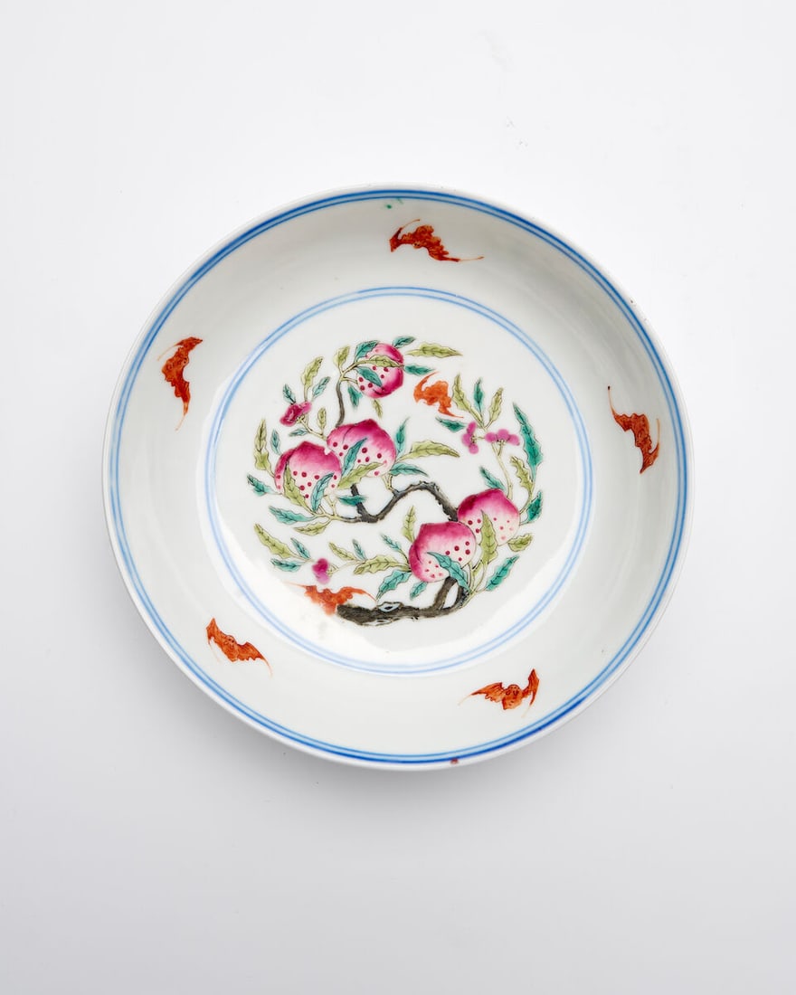 A FAMILIE ROSE 'BATS AND PEACHES' PLATE Qianlong six-character mark, 20th century (1 of 2)