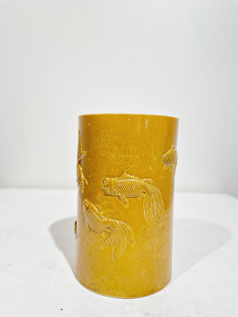 A CARVED YELLOW-GLAZED BISCUIT 'FISH' BRUSH POT Four-character studio mark, Republic Period - 4