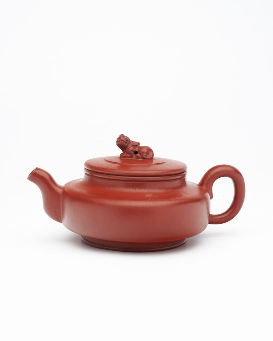 A YIXING TEAPOT Seal marks of Gu Jingzhou (1915-1996), 20th century: A YIXING TEAPOT Seal marks of Gu Jingzhou (1915-1996), 20th century 16.0cm long Footnotes: 二十世紀 顧景舟（款）