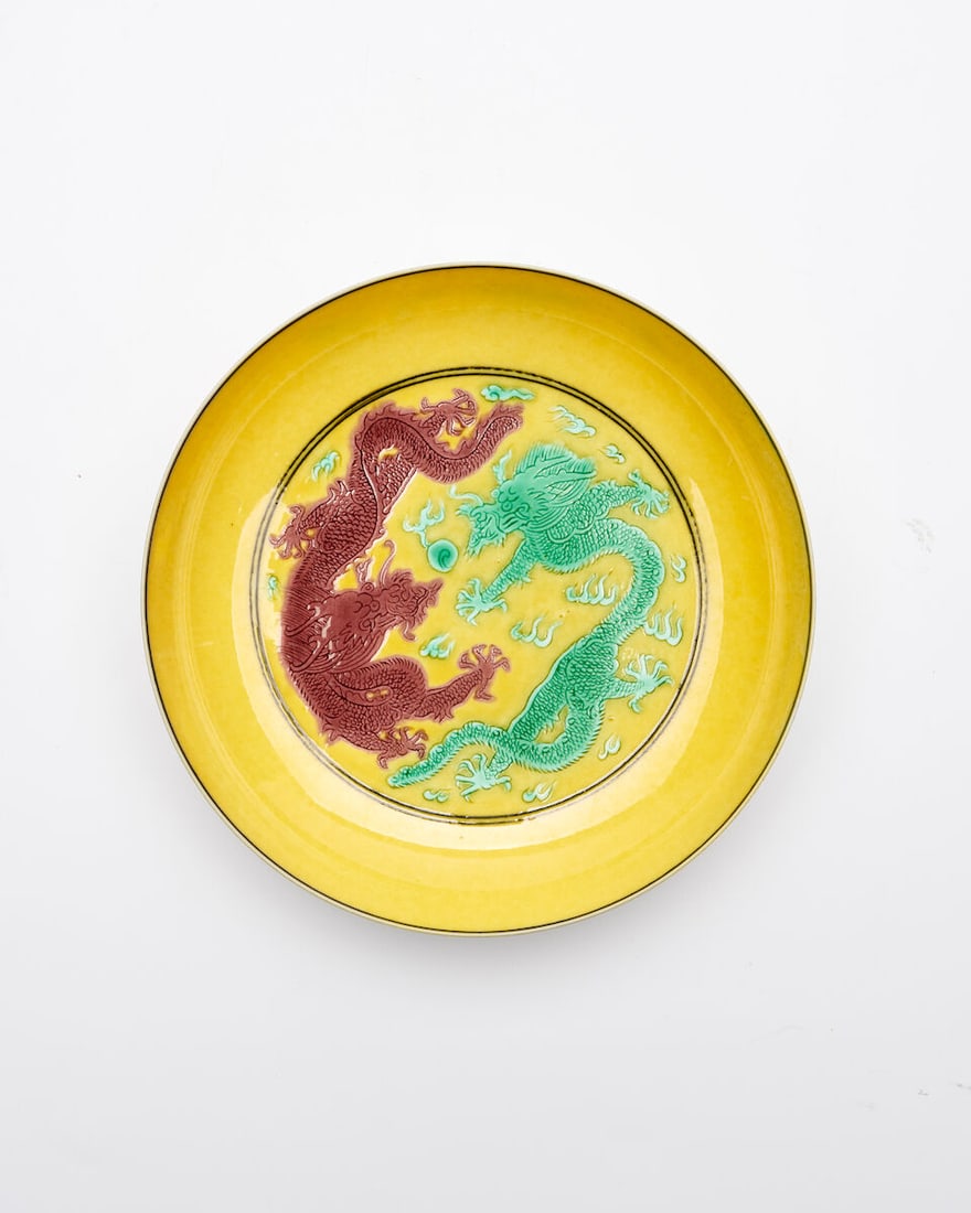 A YELLOW GROUND GREEN AND AUBERGINE 'DRAGON' DISH Guangxu six-character mark, 20th century (1 of 2)