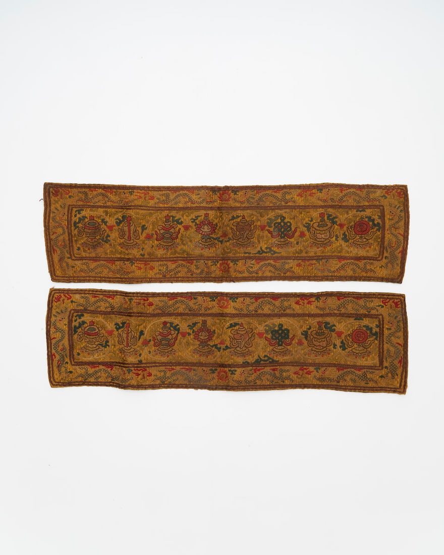 A PAIR OF EMBROIDERED 'BUDDHIST EMBLEM' SUTRA COVERS 19th/20th century (2): A PAIR OF EMBROIDERED 'BUDDHIST EMBLEM' SUTRA COVERS 19th/20th century 43.4cm long (2). Footnotes: 十九/二十世紀 刺綉八吉祥紋