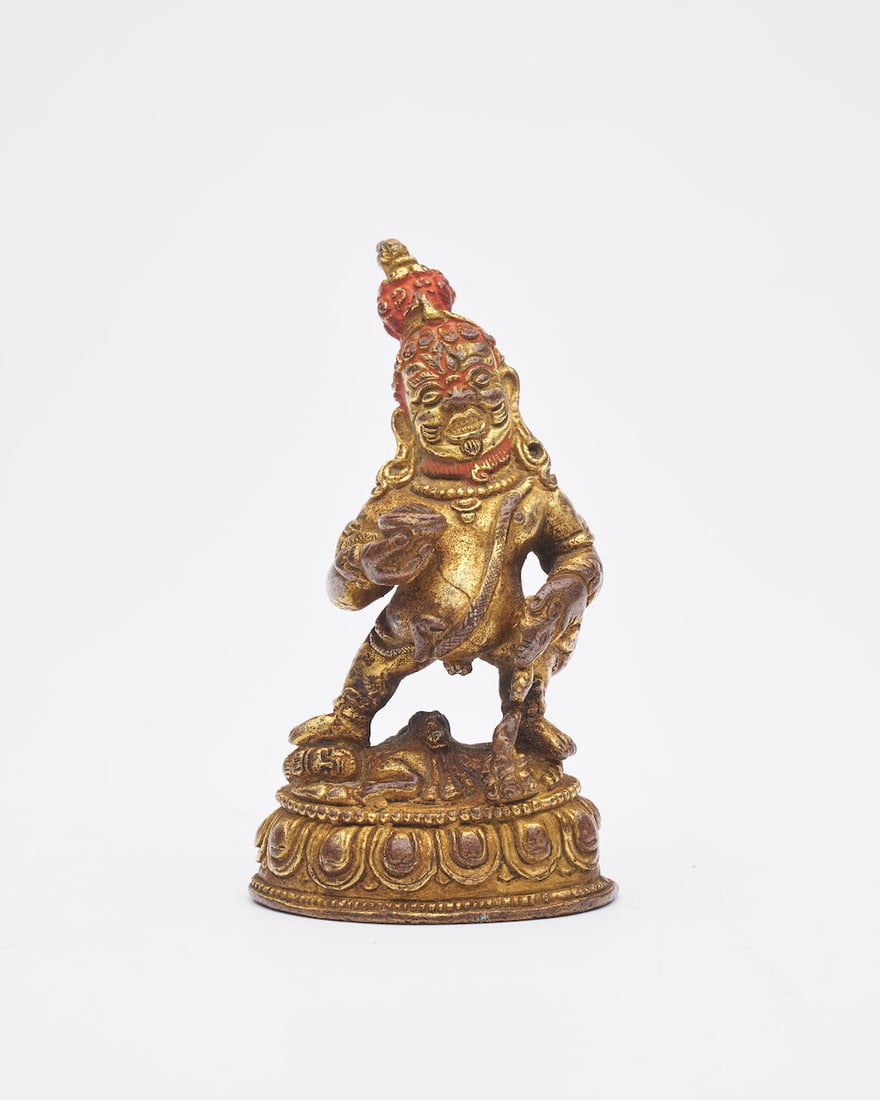 A GILT BRONZE FIGURE OF MAHAKALA 19th/20th century: A GILT BRONZE FIGURE OF MAHAKALA 19th/20th century 9.2cm high Footnotes: 十九/二十世紀 鎏金銅大黑天立像 For further