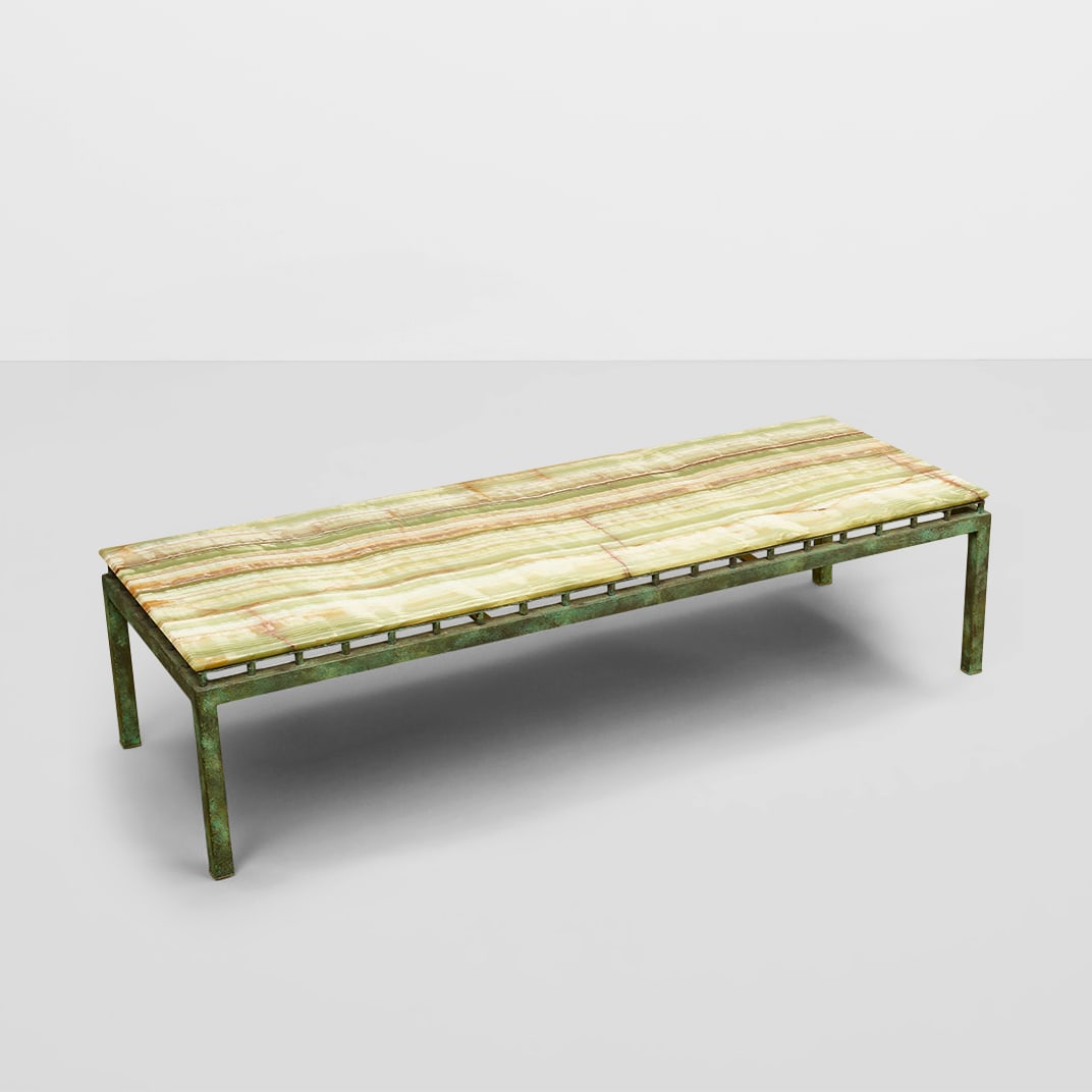 WILLIAM HAINES (1900-1973) Onyx Topped Coffee Tableonyx, patinated metalheight 15 1/4in (38.7cm)...: WILLIAM HAINES (1900-1973) Onyx Topped Coffee Table onyx, patinated metal height 15 1/4in (38.7cm); length 60 3/4in (154.3cm); width 21 3/4in (55.2cm) Footnotes: Provenance Billy Haines, Lorna Lane Re