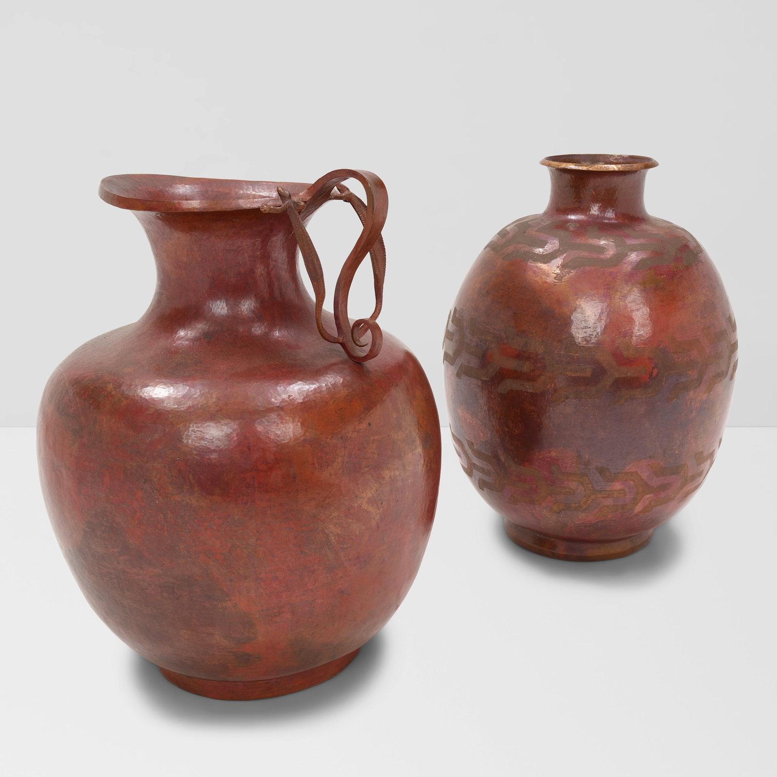 A HAMMERED COPPER LARGE HANDLED JUG AND POT OWNED BY WILLIAM HAINES Mexican, mid 20th centuryhei...: A HAMMERED COPPER LARGE HANDLED JUG AND POT OWNED BY WILLIAM HAINES Mexican, mid 20th century height of tallest 20 1/4in (51.4cm); diameter 15 3/4in (40cm) Footnotes: Provenance Billy Haines, Lorna La