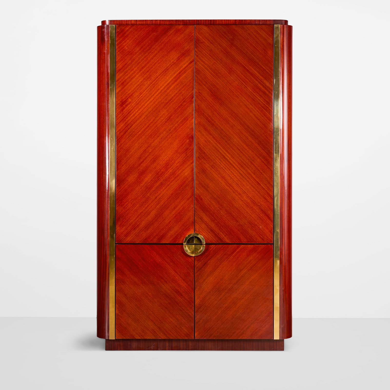 KARL SPRINGER (1931-1991) Special Order 'Oval Cabinet'circa 1985for Karl Springer Ltd., mahogany...: KARL SPRINGER (1931-1991) Special Order 'Oval Cabinet' circa 1985 for Karl Springer Ltd., mahogany, polished brass height 91 1/2in (233cm); width 54 1/2in (138cm); depth 27in (68.5cm) Footnotes: Prove