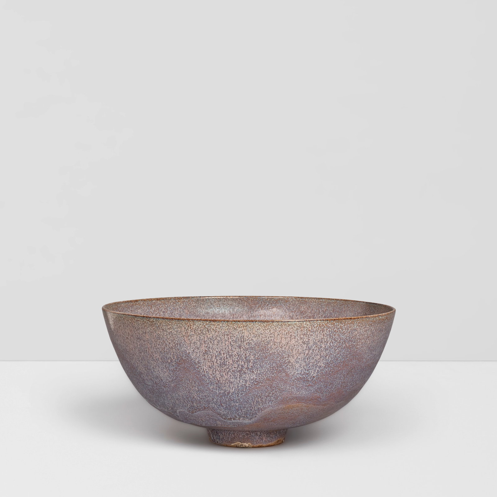 GERTRUD (1908-1971) AND OTTO NATZLER (1908-2007) Footed Bowl1958earthenware with lavender hare's...: GERTRUD (1908-1971) AND OTTO NATZLER (1908-2007) Footed Bowl 1958 earthenware with lavender hare's fur glaze, signed 'NATZLER' on underside with applied paper label numbered 'J955' height 4in (10.1cm)