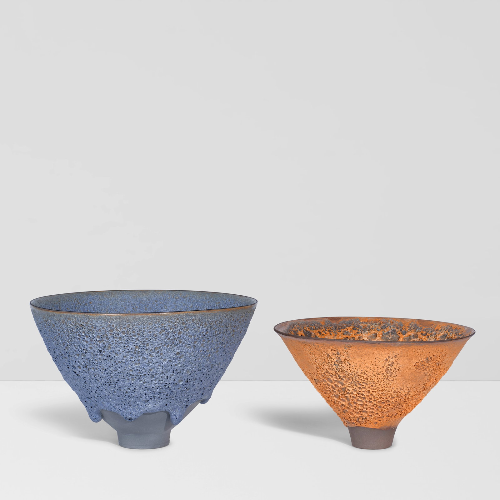 JAMES LOVERA (1920-2015) Two Footed Bowlscrater glazed earthenware, each incised 'lovera' on und...: JAMES LOVERA (1920-2015) Two Footed Bowls crater glazed earthenware, each incised 'lovera' on underside height of larger bowl 6 1/2in (16.5cm); diameter 9 3/4in (25cm); height of smaller bowl 5 1/4in 