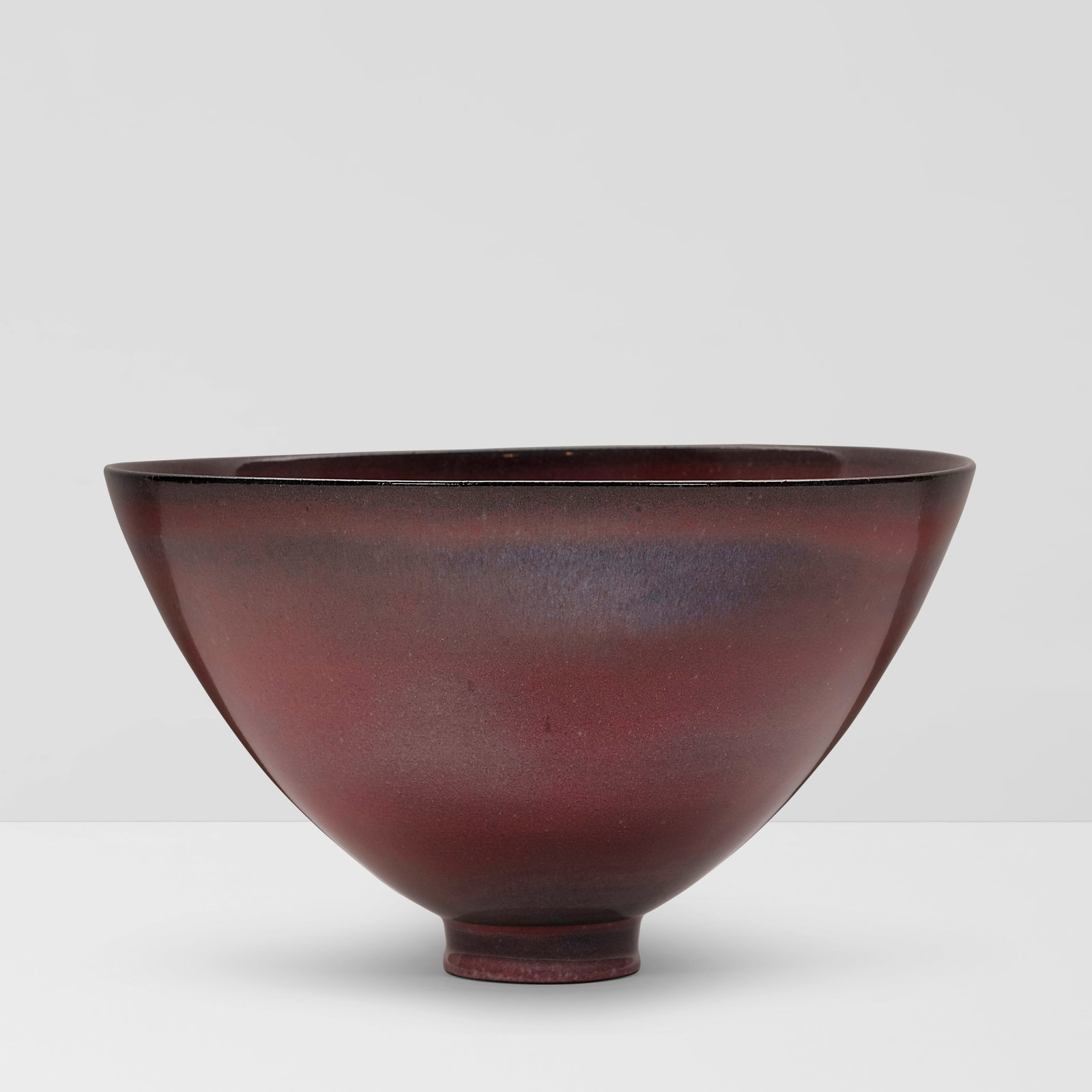 JAMES LOVERA (1920-2015) Footed Bowlglazed porcelain, incised 'lovera' on underside height 5in (...: JAMES LOVERA (1920-2015) Footed Bowl glazed porcelain, incised 'lovera' on underside height 5in (12.5cm); diameter 8 1/2in (22cm) This lot is subject to the following lot symbols: ¤ ¤ Unless