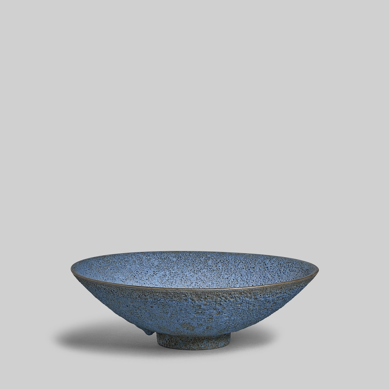 JAMES LOVERA (1920-2015) Large Footed Bowllava-glazed earthenware, incised 'lovera' on underside...: JAMES LOVERA (1920-2015) Large Footed Bowl lava-glazed earthenware, incised 'lovera' on underside height 4 1/4in (10.8cm); diameter 14 in (35.6cm) For further information on this lot please visit Bonh
