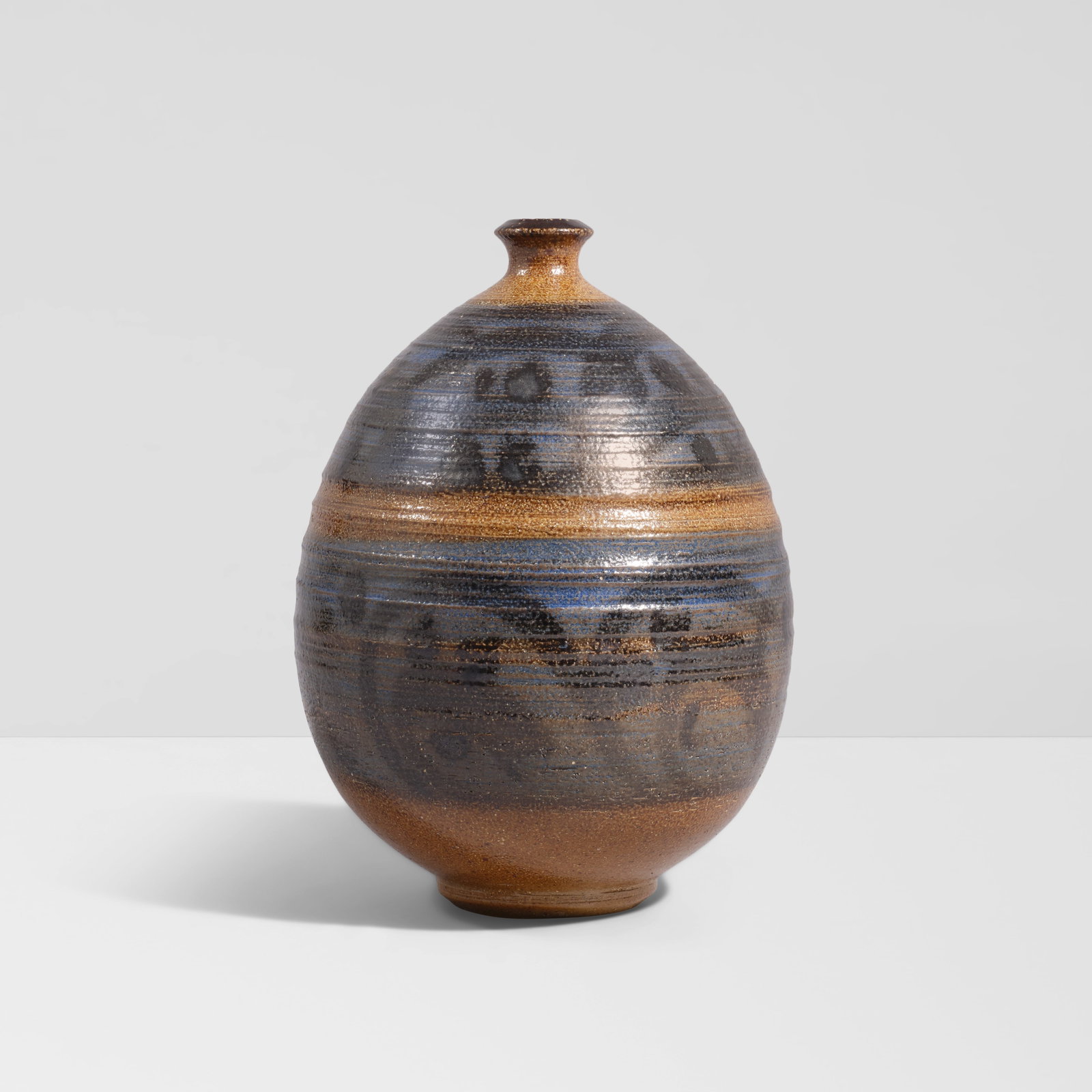 PETER VOULKOS (1924-2002) Double-Banded Bottle Form1950sglazed stoneware, incised 'Voulkos' on ...: PETER VOULKOS (1924-2002) Double-Banded Bottle Form 1950s glazed stoneware, incised 'Voulkos' on underside height 8 1/4in (21cm); diameter 6in (15.3cm) Saleroom notices: Exhibited: Beverly Hills, Cali